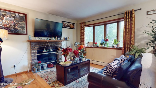 619 Rimrock Rd, Bartonsville, PA 18321 - living room with a fireplace, wood finished floors, and baseboard heating