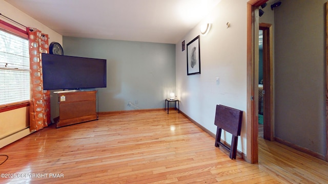 619 Rimrock Rd, Bartonsville, PA 18321 - unfurnished living room featuring light wood-style floors and a baseboard radiator