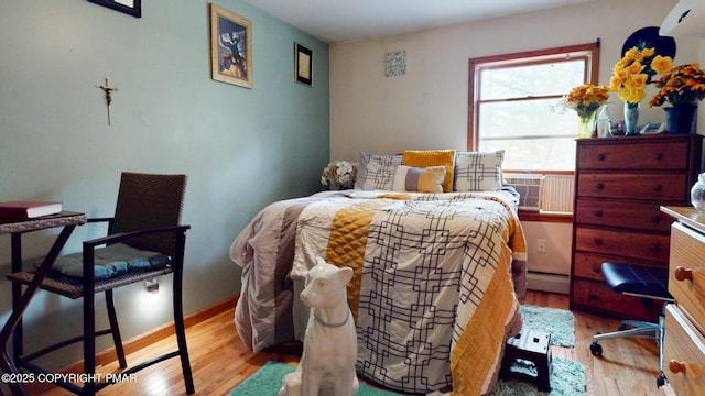 619 Rimrock Rd, Bartonsville, PA 18321 - bedroom featuring wood finished floors and a baseboard radiator