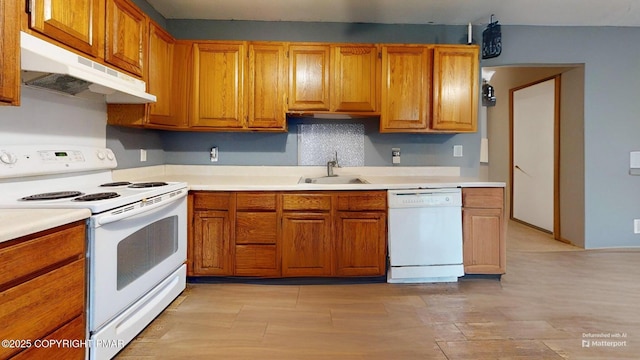 619 Rimrock Rd, Bartonsville, PA 18321 - kitchen featuring white appliances, under cabinet range hood, and brown cabinetry