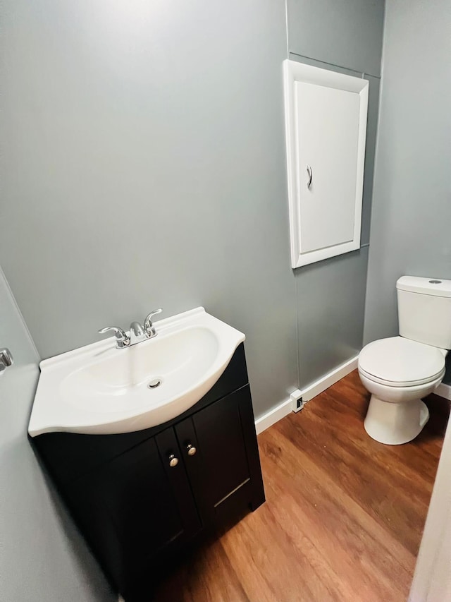 1116 Diamond Ave, Scranton, PA 18508 - bathroom featuring toilet, vanity, and wood finished floors