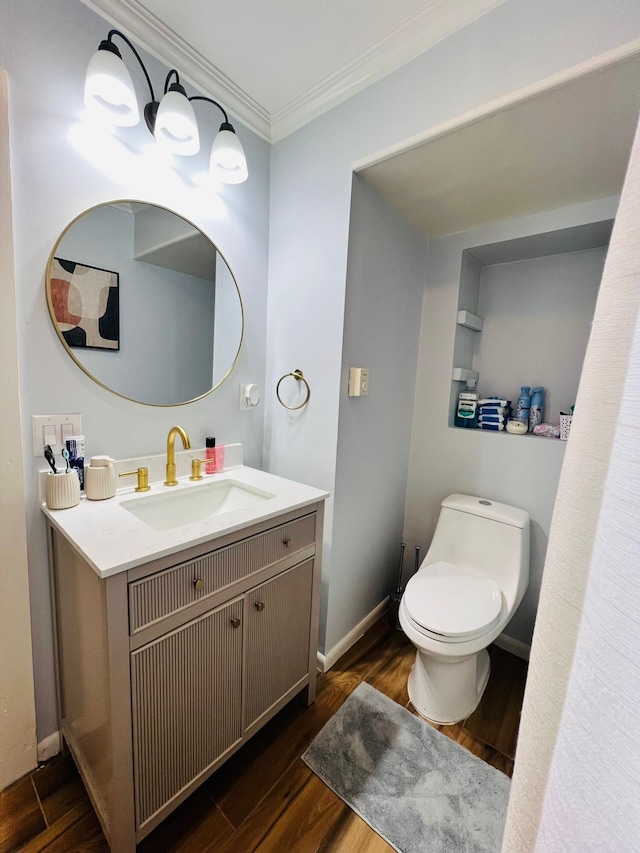 1116 Diamond Ave, Scranton, PA 18508 - bathroom featuring vanity, toilet, crown molding, wood finished floors, and baseboards