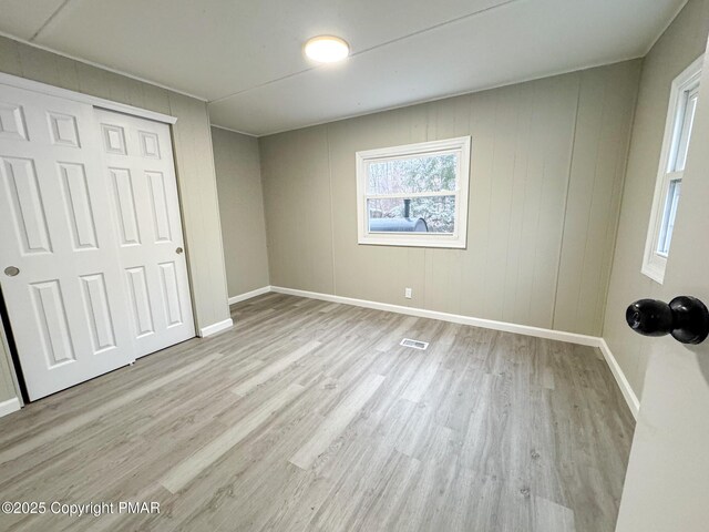 corridor featuring light hardwood / wood-style floors