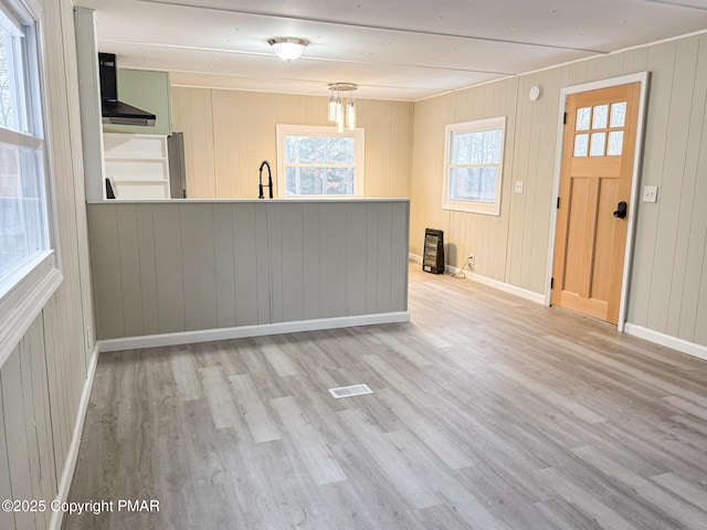 interior space featuring sink and light wood-type flooring