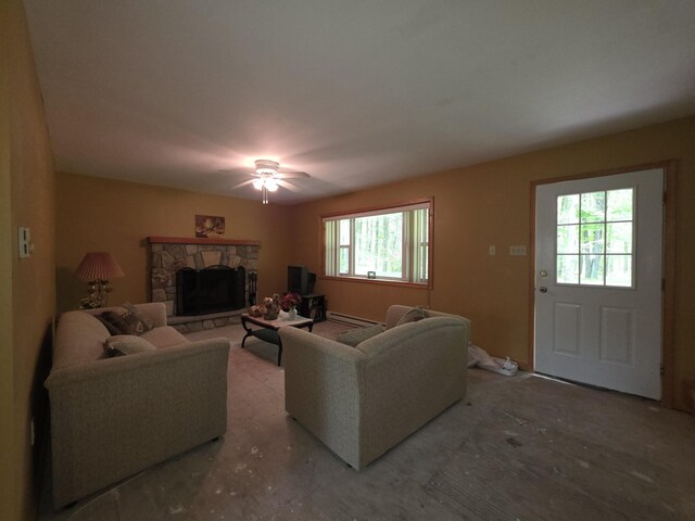 131 Pine Dr, Pocono Lake, PA 18347 - living area featuring baseboard heating, a fireplace, and a ceiling fan