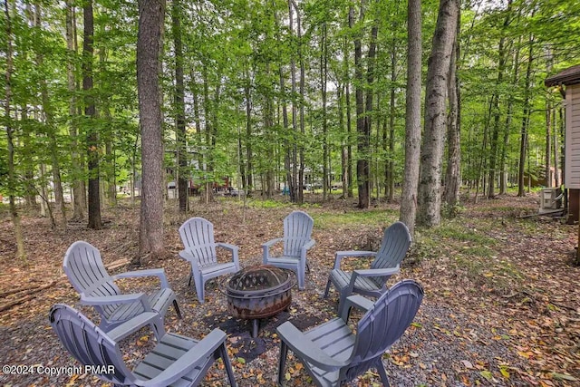 view of patio with a fire pit