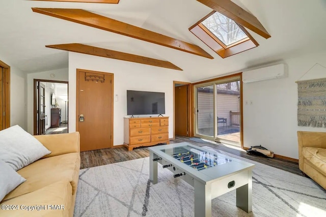 living area with a wall unit AC, a healthy amount of sunlight, vaulted ceiling with skylight, and wood finished floors