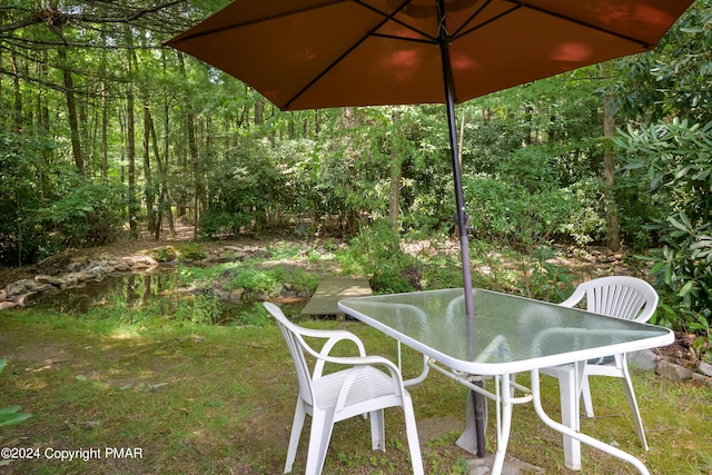 view of patio featuring outdoor dining area