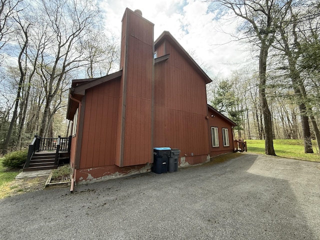 343 Echo Lake Rd, Tobyhanna, PA 18466 - view of side of home with a chimney and a wooden deck