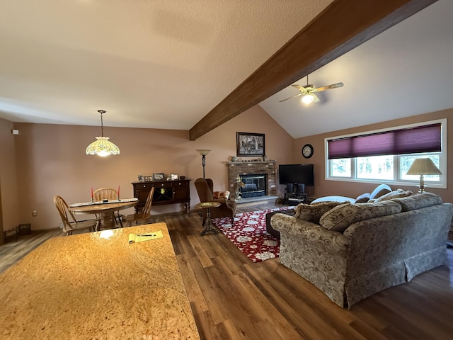 343 Echo Lake Rd, Tobyhanna, PA 18466 - living area featuring wood finished floors, a ceiling fan, a brick fireplace, and vaulted ceiling with beams