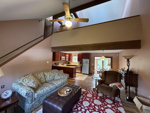 343 Echo Lake Rd, Tobyhanna, PA 18466 - living room with beam ceiling, light wood-style flooring, a ceiling fan, and high vaulted ceiling