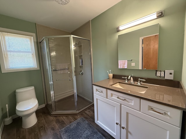 343 Echo Lake Rd, Tobyhanna, PA 18466 - bathroom featuring vanity, toilet, a shower stall, and wood finished floors