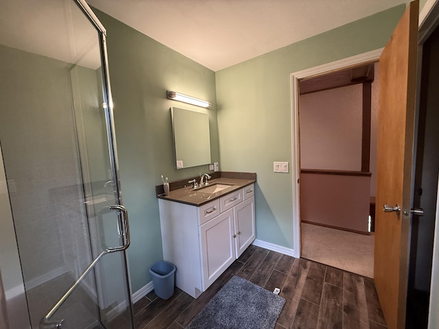 343 Echo Lake Rd, Tobyhanna, PA 18466 - full bathroom with a stall shower, vanity, wood finish floors, and baseboards