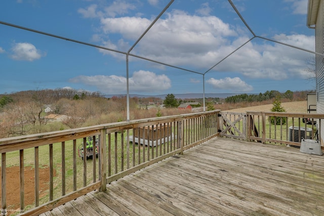 wooden terrace featuring central AC unit