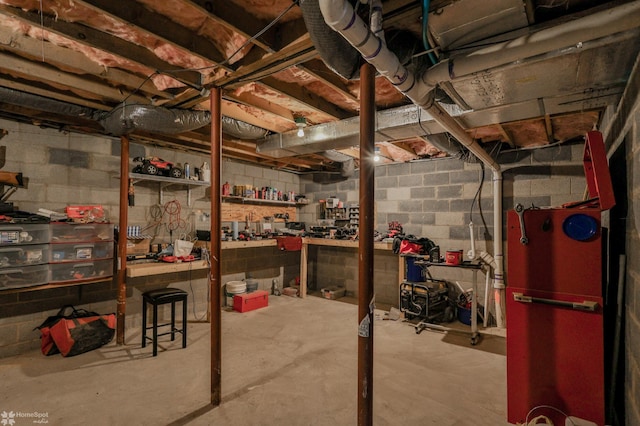 unfinished below grade area with a workshop area