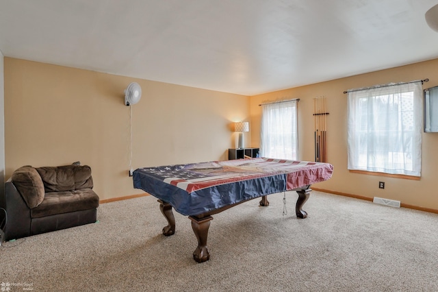 recreation room featuring carpet floors, visible vents, and baseboards