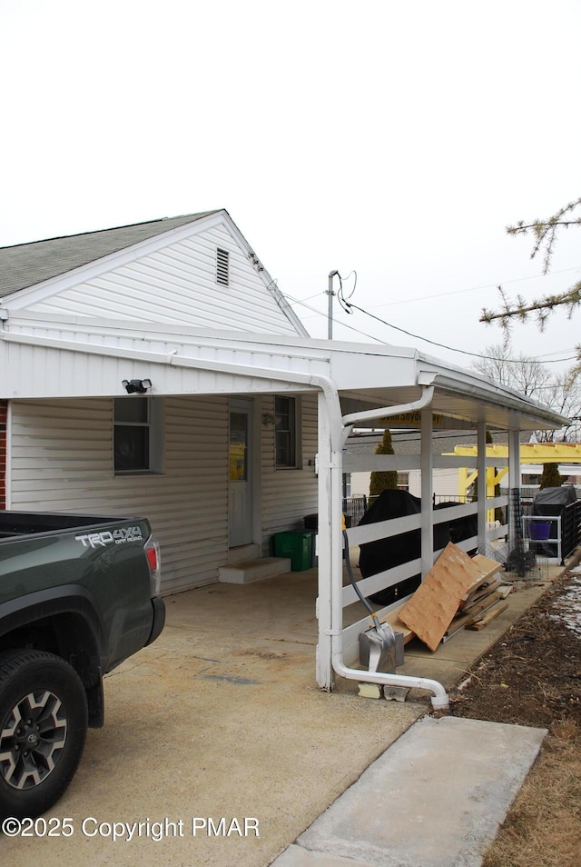 exterior space featuring a carport