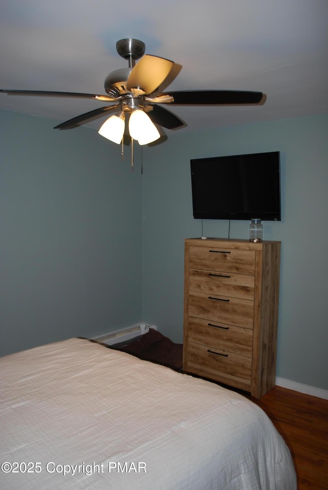 bedroom featuring hardwood / wood-style flooring and ceiling fan