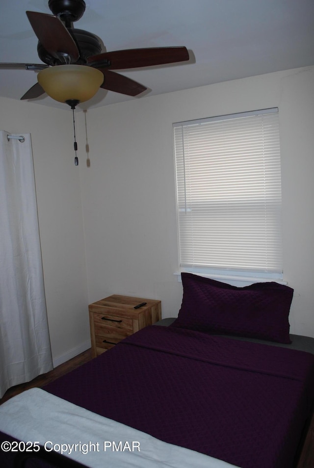 unfurnished bedroom featuring ceiling fan