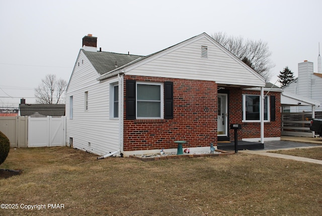 bungalow-style house with a front lawn