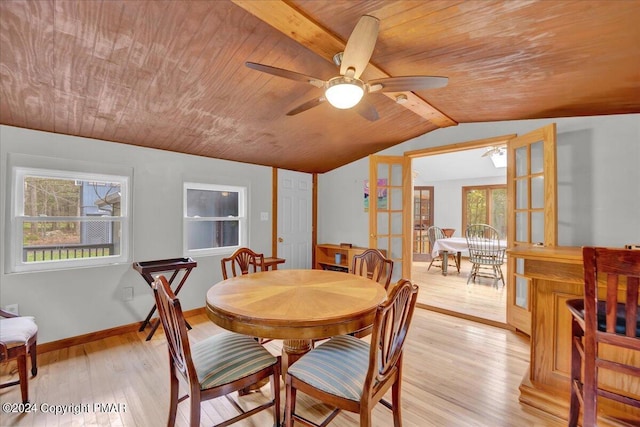 dining room with french doors, lofted ceiling, ceiling fan, and light wood finished floors