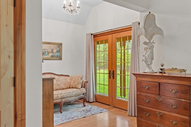 127 Timber Lake Dr, Canadensis, PA 18325 - doorway to outside featuring french doors, vaulted ceiling, light wood finished floors, and a chandelier