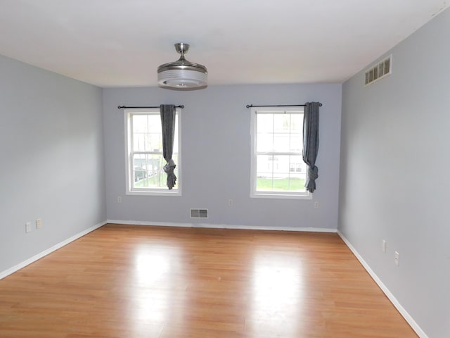 8150 Mayfair Rd, Tobyhanna, PA 18466 - unfurnished room featuring plenty of natural light, light wood-style flooring, and baseboards
