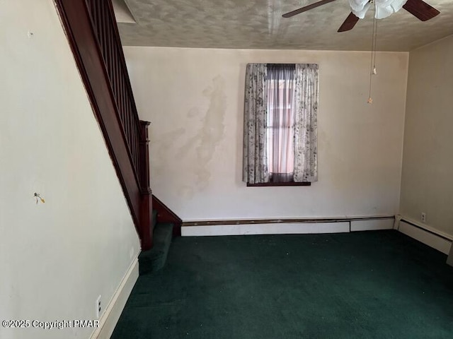 spare room featuring carpet floors and ceiling fan