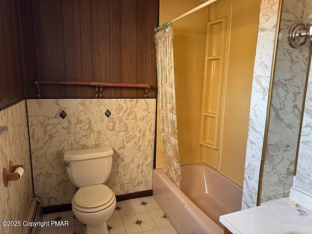 bathroom featuring shower / bath combination with curtain and toilet