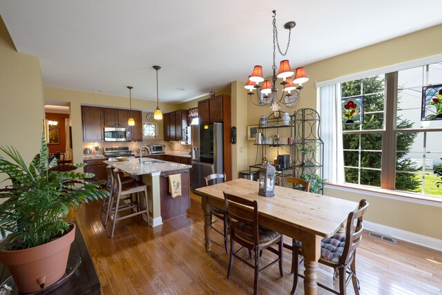 2772 Sheffield Dr, Easton, PA 18040 - dining room with light wood-style floors and a chandelier