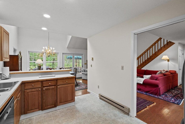 606 Buck Cir, Buck Hill Falls, PA 18323 - kitchen featuring baseboard heating, stainless steel dishwasher, a peninsula, a chandelier, and brown cabinetry