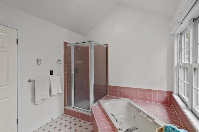 606 Buck Cir, Buck Hill Falls, PA 18323 - bathroom with vaulted ceiling, a tub with jets, and a shower stall
