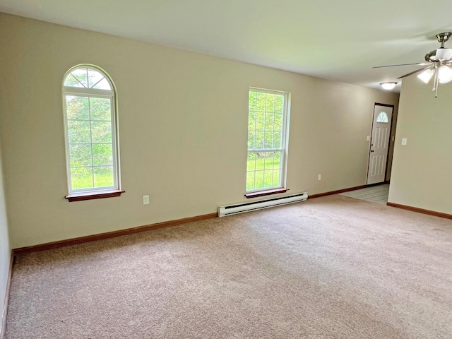 2138 Hill Rd, Effort, PA 18330 - carpeted spare room featuring a baseboard heating unit, healthy amount of natural light, and ceiling fan