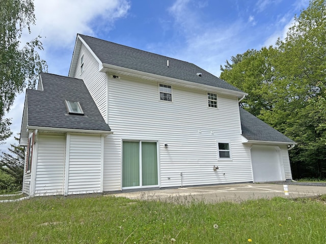 2138 Hill Rd, Effort, PA 18330 - rear view of property featuring roof with shingles and an attached garage