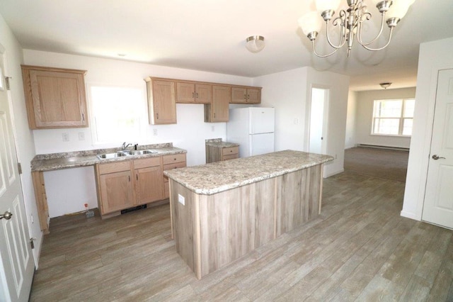 1025 W Princeton Ave, Palmerton, PA 18071 - kitchen featuring freestanding refrigerator, light wood-style flooring, a center island, and a chandelier