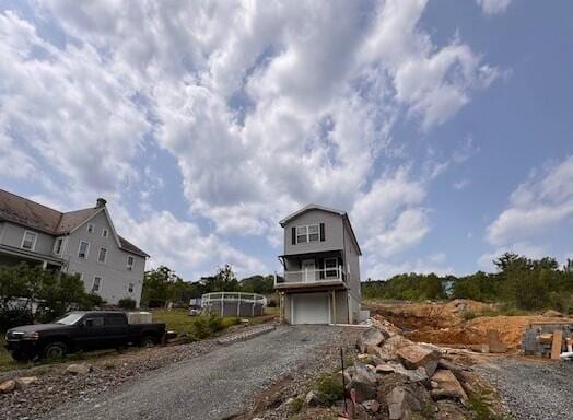 1025 W Princeton Ave, Palmerton, PA 18071 - view of front facade with gravel driveway and an attached garage