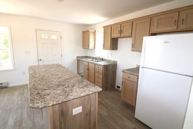 1025 W Princeton Ave, Palmerton, PA 18071 - kitchen with freestanding refrigerator, dark wood-style flooring, a kitchen island, and light stone countertops