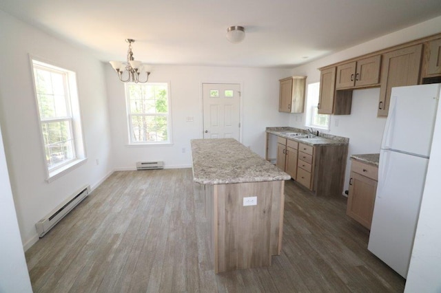 1025 W Princeton Ave, Palmerton, PA 18071 - kitchen with freestanding refrigerator, baseboard heating, a chandelier, and wood finished floors