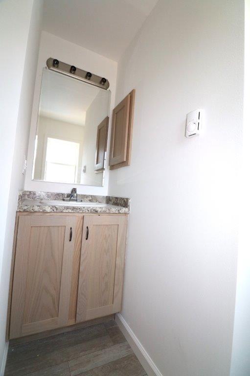 1025 W Princeton Ave, Palmerton, PA 18071 - bathroom featuring vanity and wood finished floors