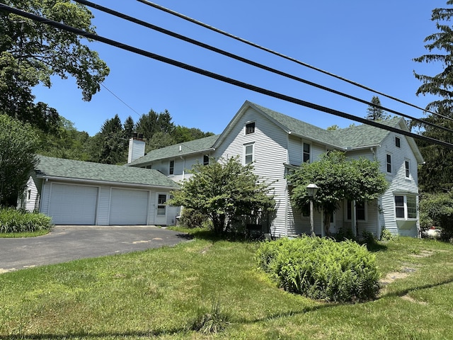 337 Summit Rd, Swiftwater, PA 18370 - view of front of property featuring a garage, a front lawn, and roof with shingles