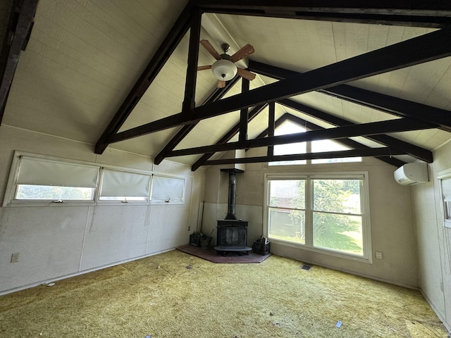 337 Summit Rd, Swiftwater, PA 18370 - unfurnished living room with a wood stove, a wall mounted air conditioner, carpet flooring, and a ceiling fan