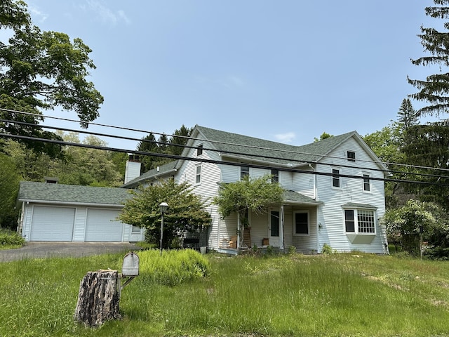 337 Summit Rd, Swiftwater, PA 18370 - view of front of house with a garage, a shingled roof, and a chimney