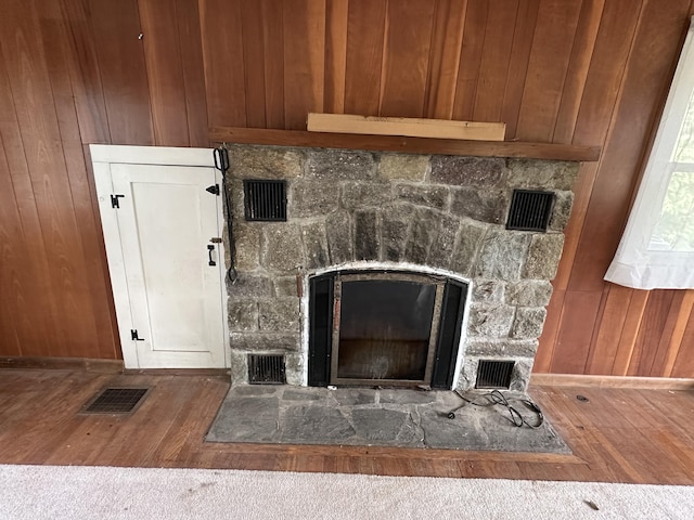 337 Summit Rd, Swiftwater, PA 18370 - detailed view of a fireplace, wood finished floors, and wooden walls