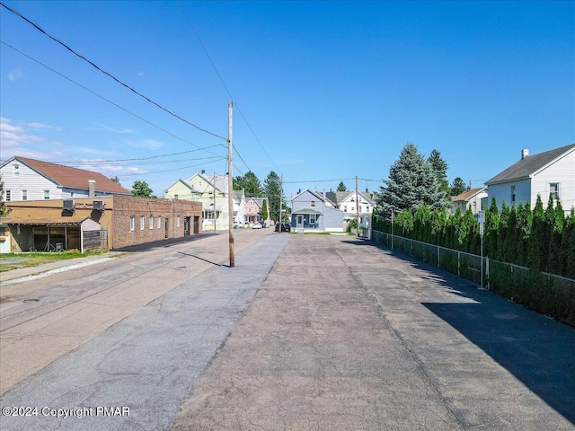 view of road with sidewalks and a residential view