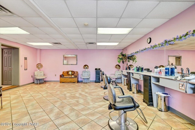 miscellaneous room with a drop ceiling, visible vents, and light tile patterned floors