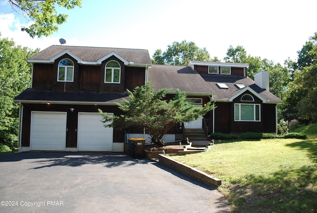 view of front of property with a front lawn, aphalt driveway, roof with shingles, an attached garage, and a chimney