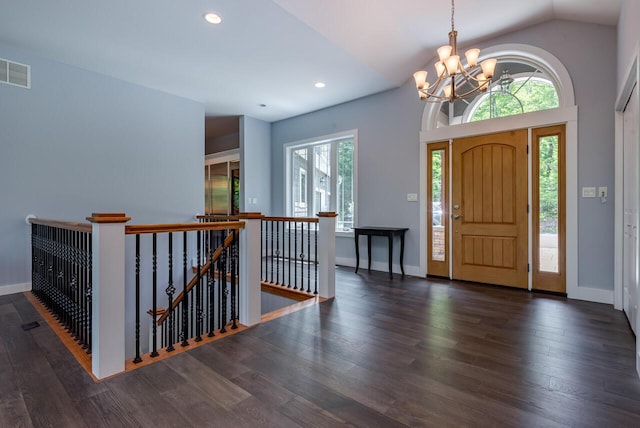 177 Wolf Hollow Rd, Lake Harmony, PA 18624 - foyer entrance featuring lofted ceiling, wood finished floors, a chandelier, and visible vents