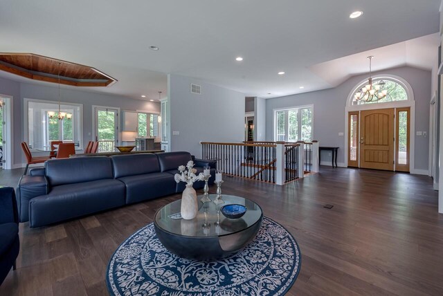 177 Wolf Hollow Rd, Lake Harmony, PA 18624 - living room with wood finished floors, baseboards, a notable chandelier, visible vents, and recessed lighting
