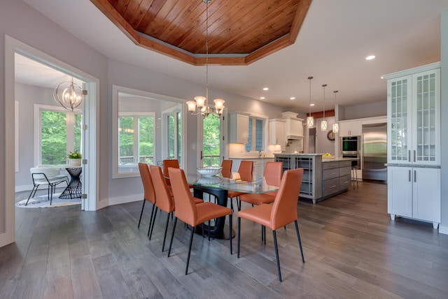 177 Wolf Hollow Rd, Lake Harmony, PA 18624 - dining space with dark wood-style floors, an inviting chandelier, a raised ceiling, wooden ceiling, and baseboards