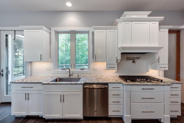 177 Wolf Hollow Rd, Lake Harmony, PA 18624 - kitchen with appliances with stainless steel finishes, tasteful backsplash, a sink, and white cabinetry